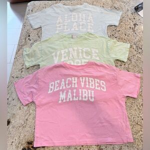 Three Zara T-Shirts. Pink 'Beach Vibes Malibu' Blue ‘Aloha’ and Green’Venice’